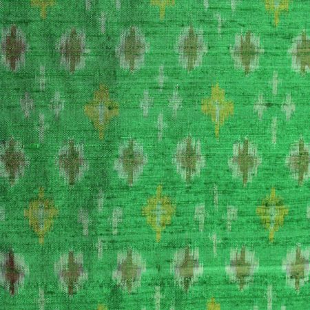 Intrigued Parakeet Green Raw Silk Ikat With Multi Color Geometrical Design Finely Knitted Fabric 1
